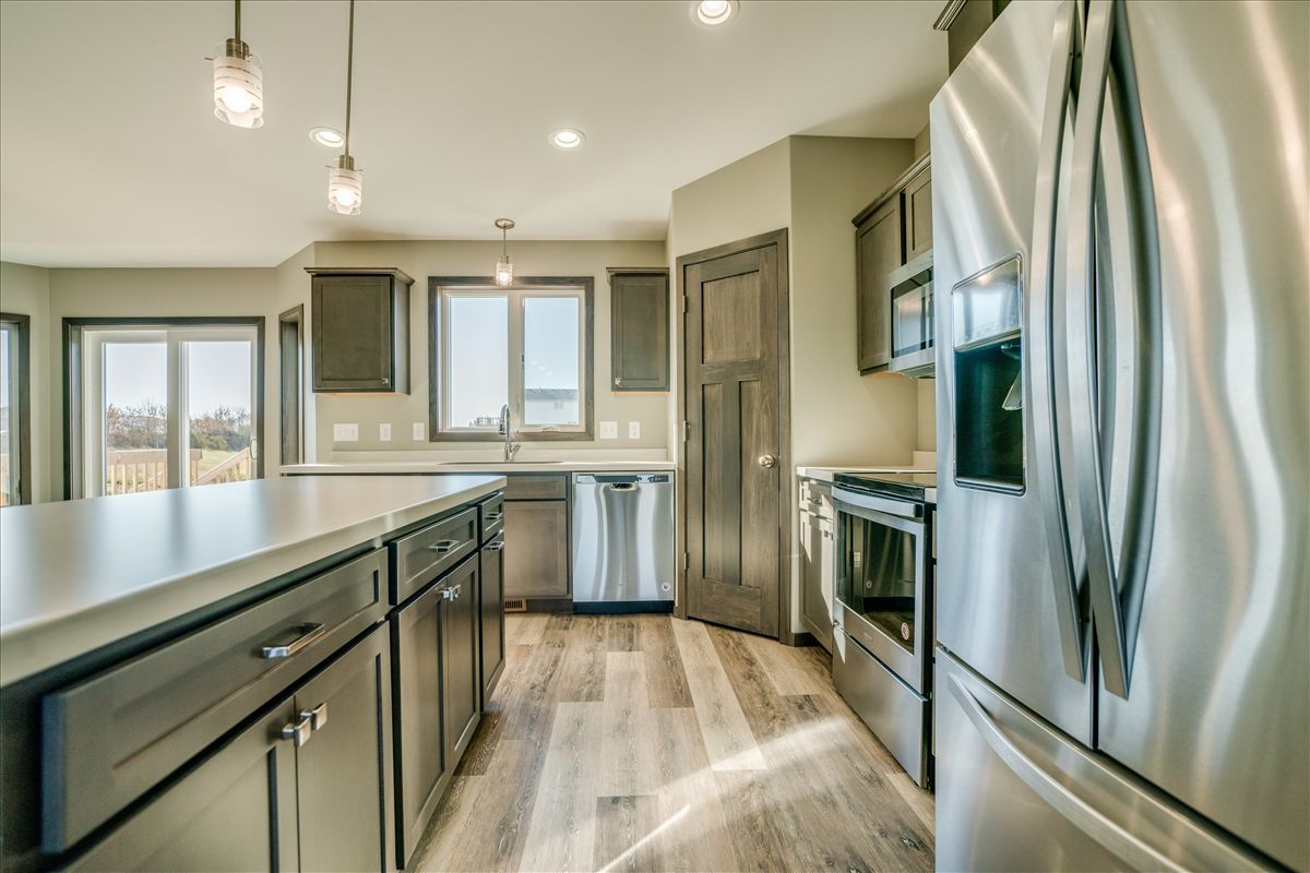 A person is writing on a piece of paper with a pen.