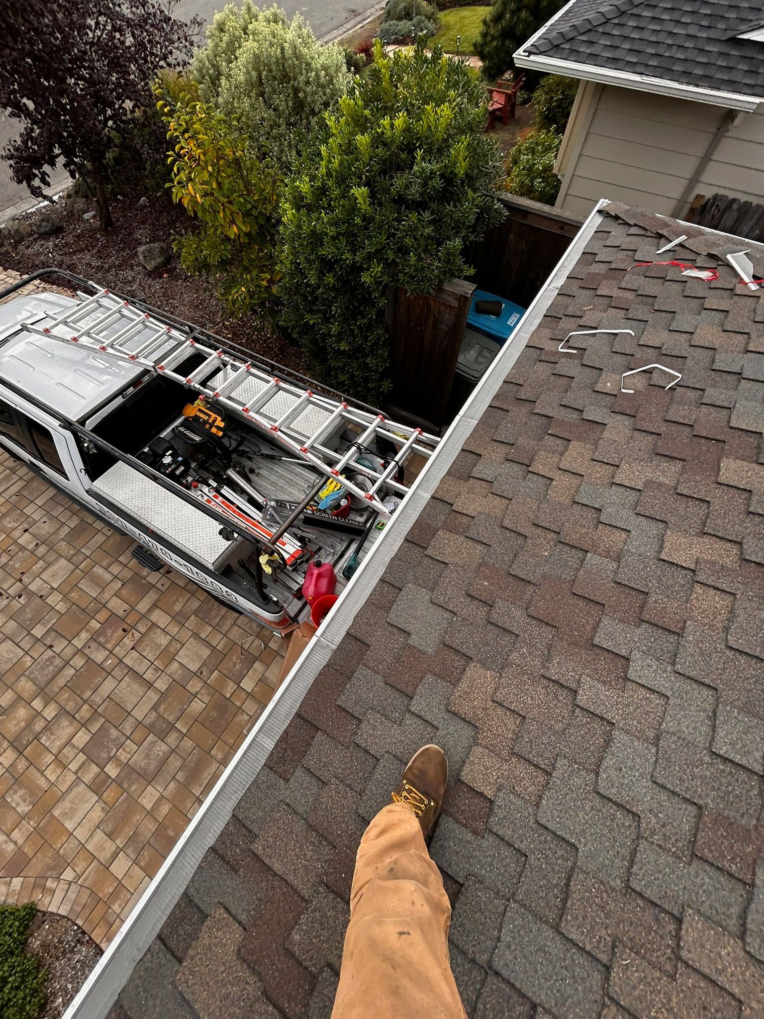 A wooden fence is sitting on top of a lush green field.