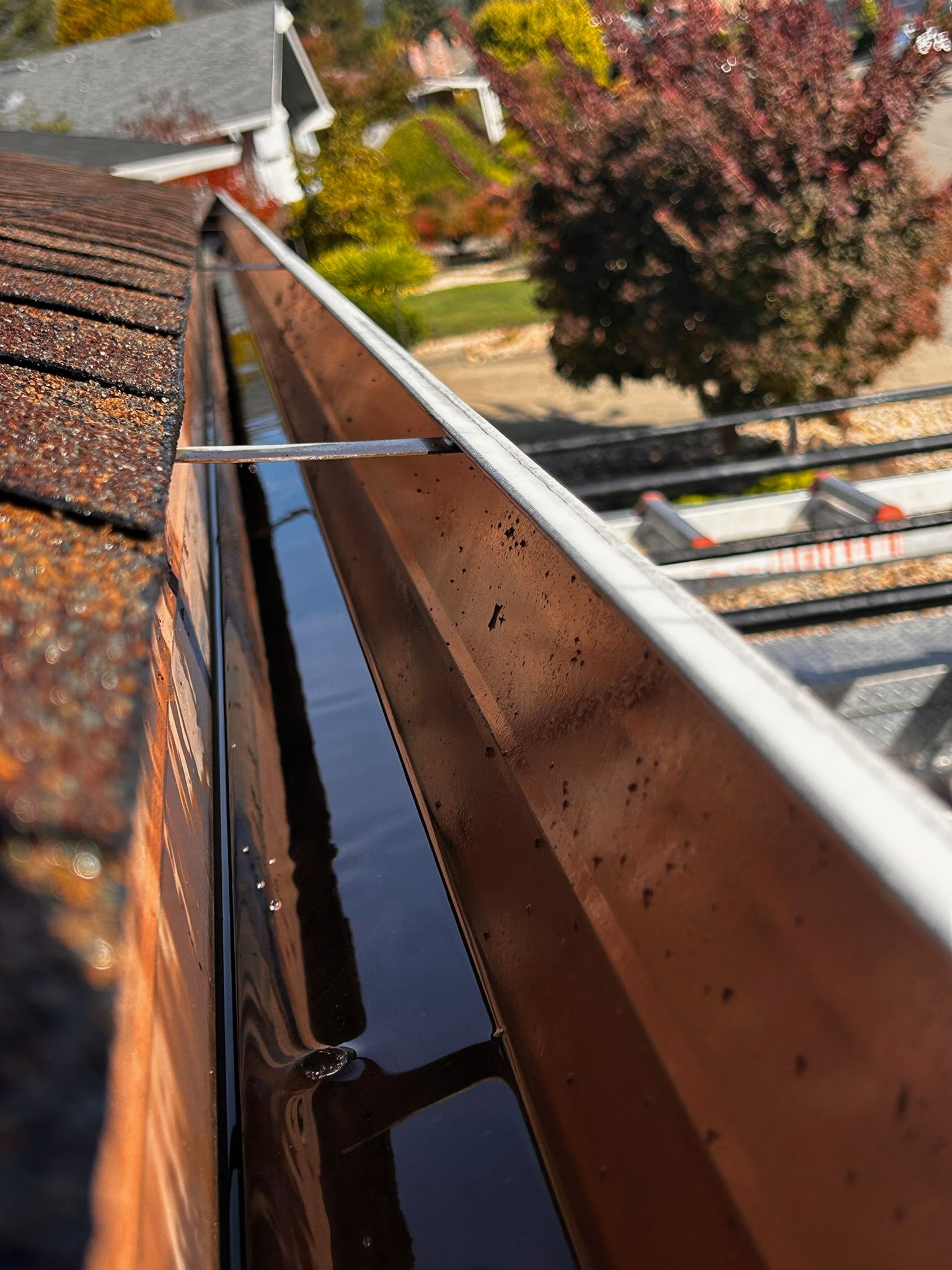 A wooden fence with a gate attached to it.