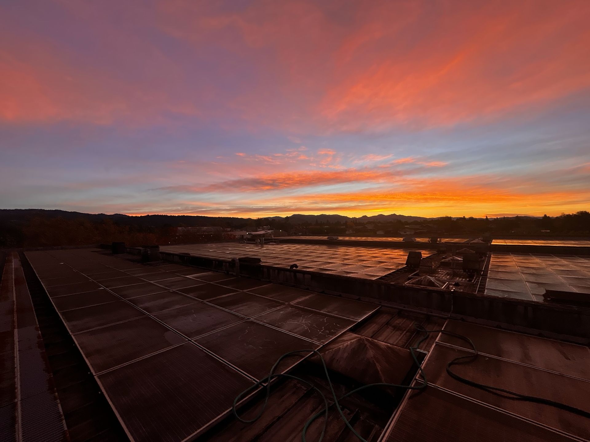 Exterior of a State Farm insurance office with a red door and a sign in the window.