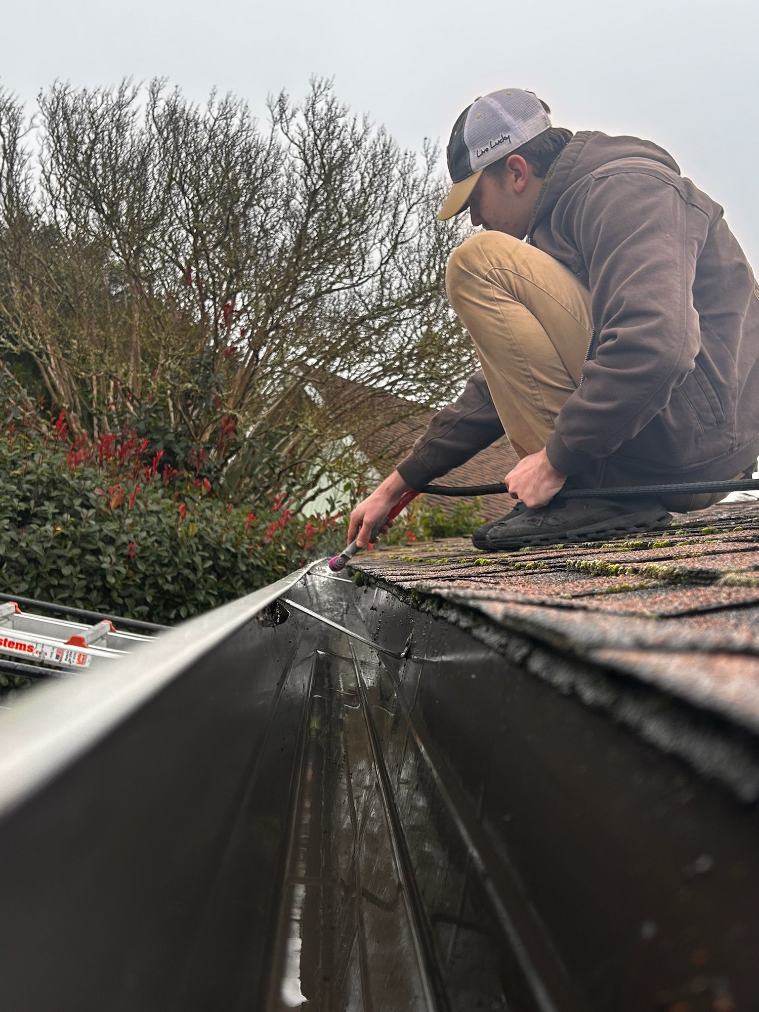 A wooden fence is sitting on top of a lush green field.