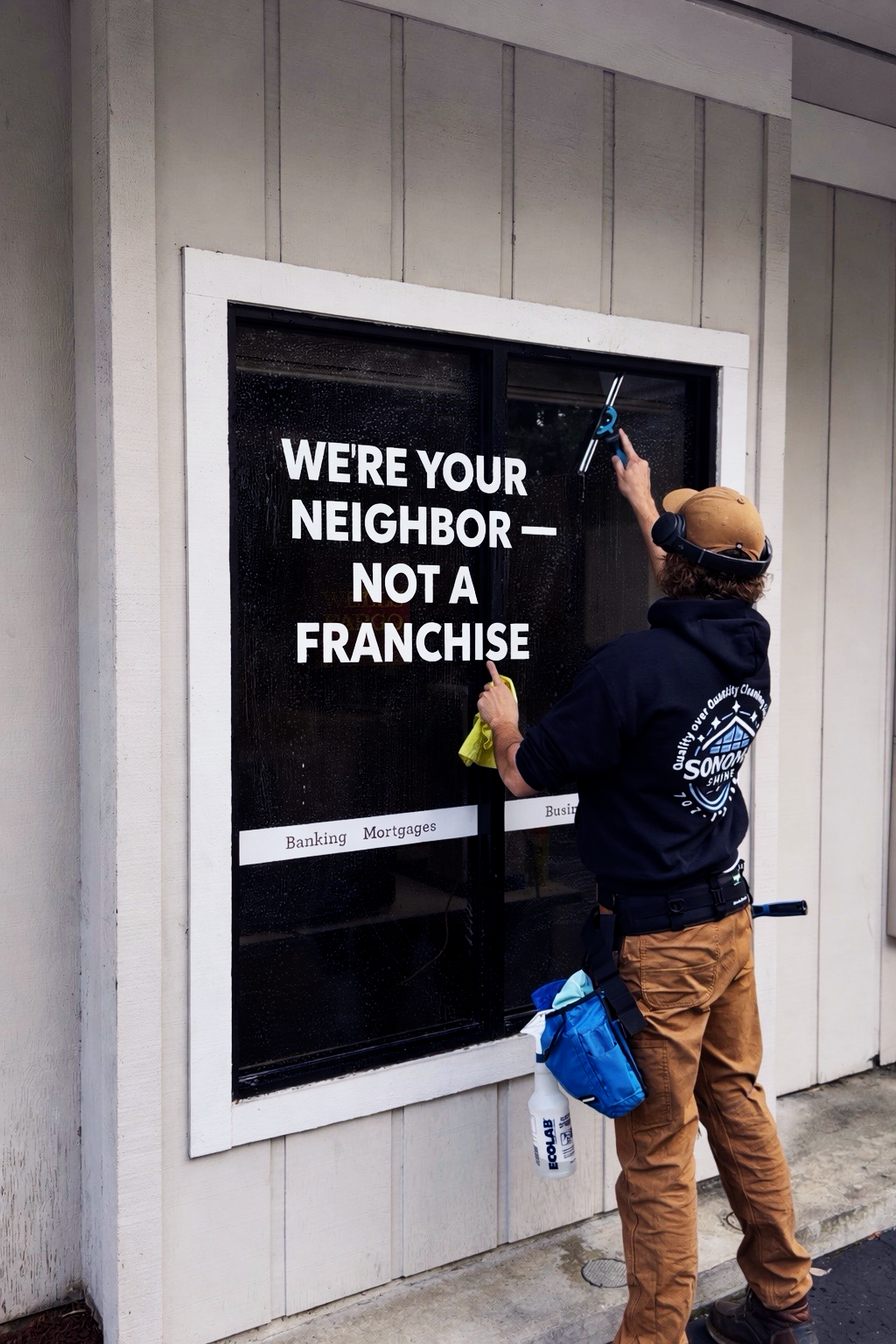 Interior restaurant view with a window overlooking outdoor seating.