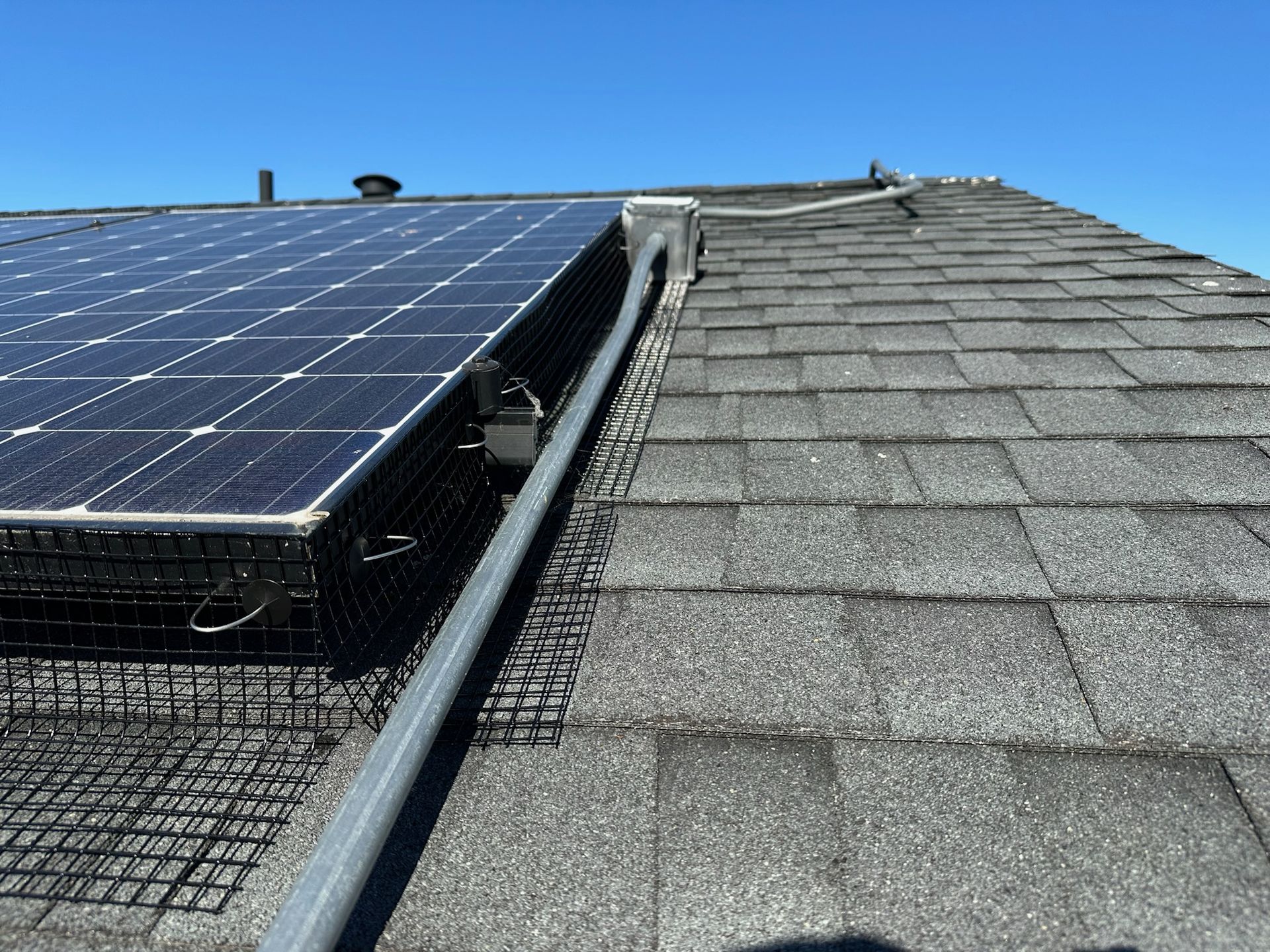 A wooden fence with a gate attached to it.