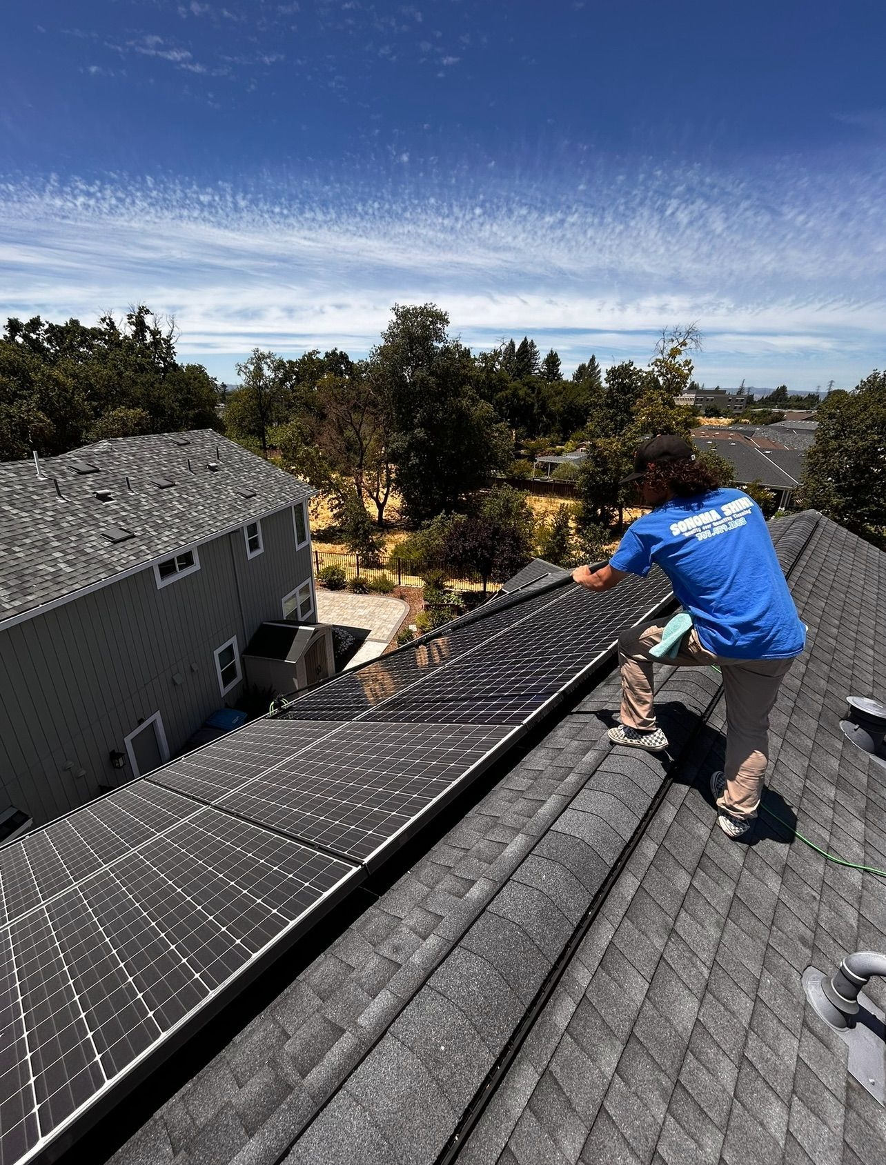 A wooden fence with a gate attached to it.