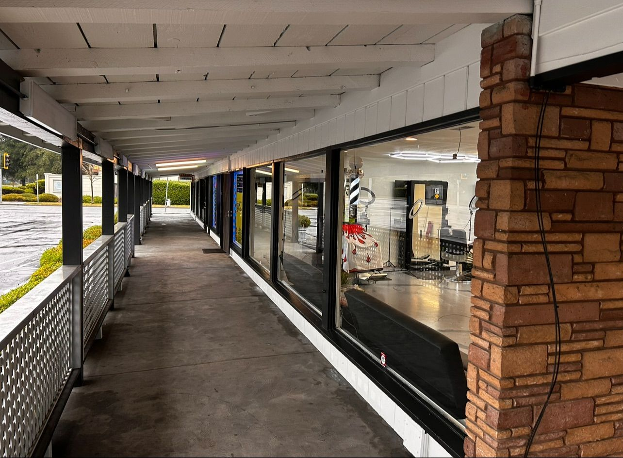A wooden fence is sitting on top of a lush green field.