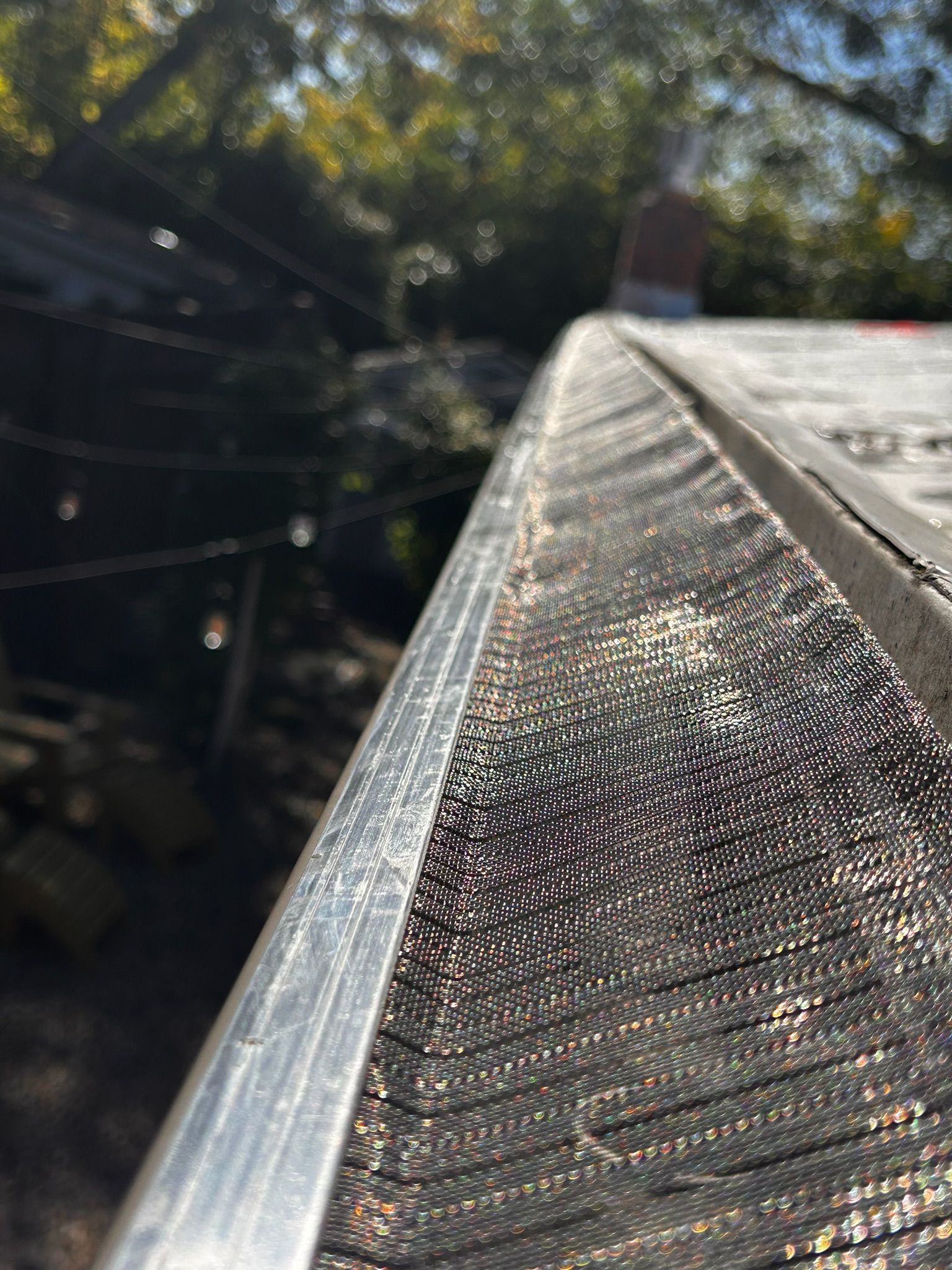 A wooden fence with a gate attached to it.