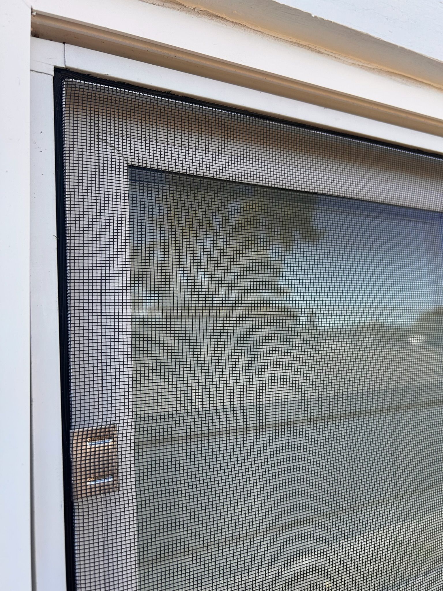 Black screen covering a window. The screen has a black frame.