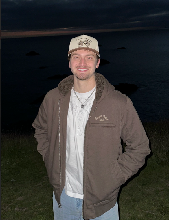 A wooden fence with a gate attached to it.