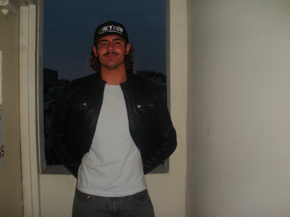 A wooden fence with a gate attached to it.