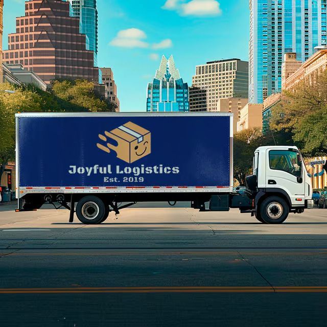 A white truck with a blue sign that says joyful logistics