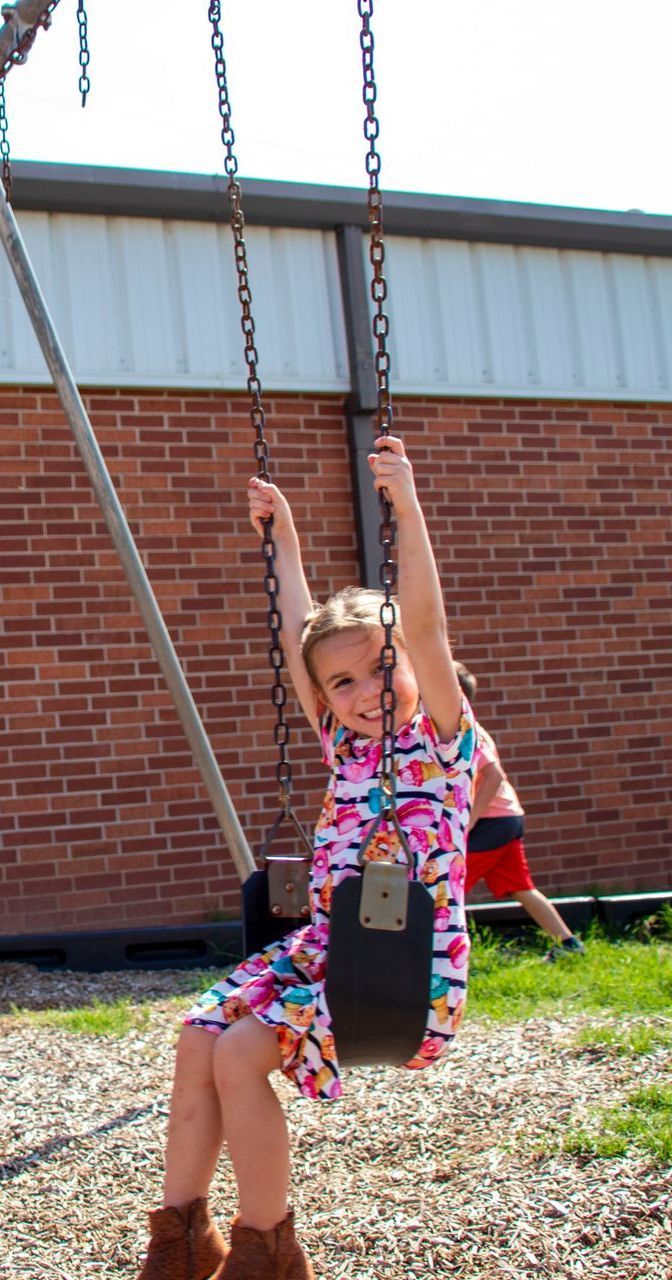 young girl on a swing