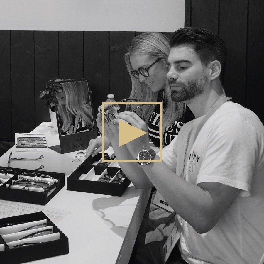 Dr Carla Schneider and Dr Sam Schneider looking at frames