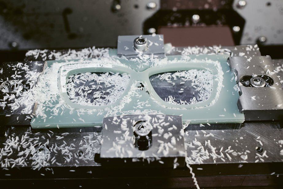 pair of glasses frames being laser cut