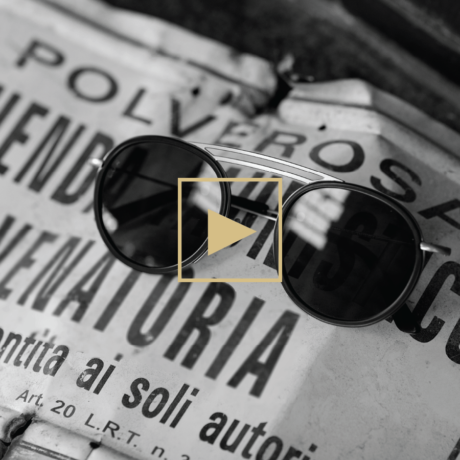 Pair of sun glasses on an old newspaper