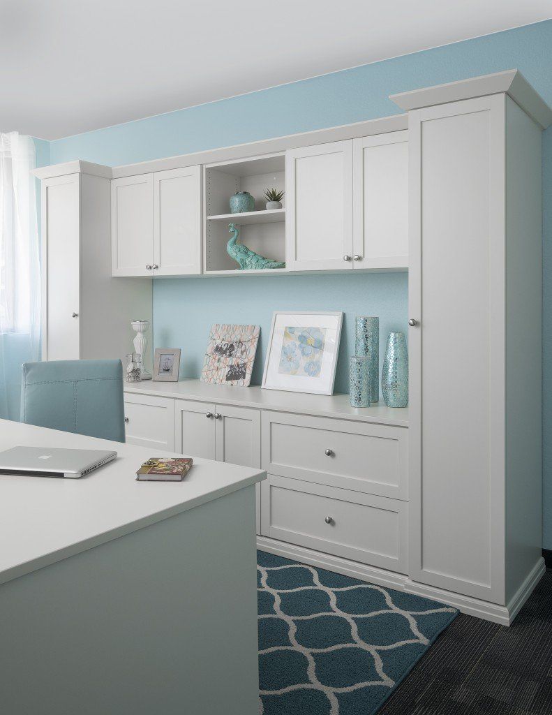 Custom home office cabinets with a white finish