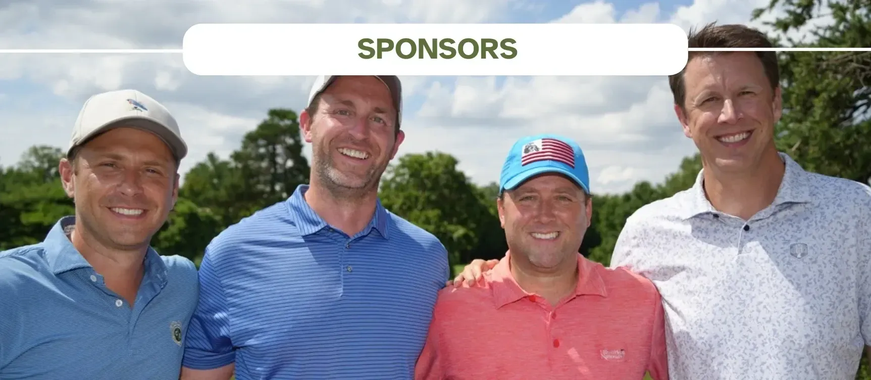 Four smiling people stand side-by-side outdoors at a golf event under a banner labeled 