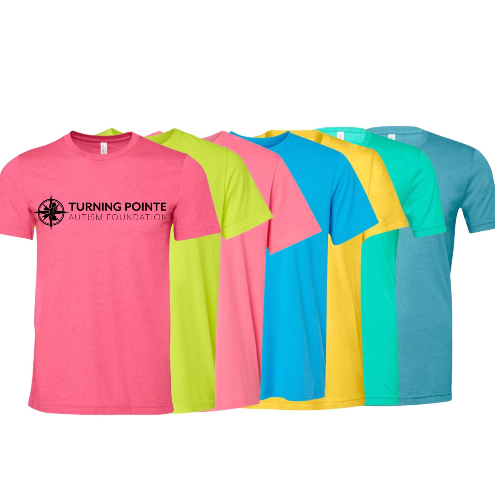 A row of T-shirts in bright colors, with the leftmost pink shirt displaying the Turning Pointe Autism Foundation logo.