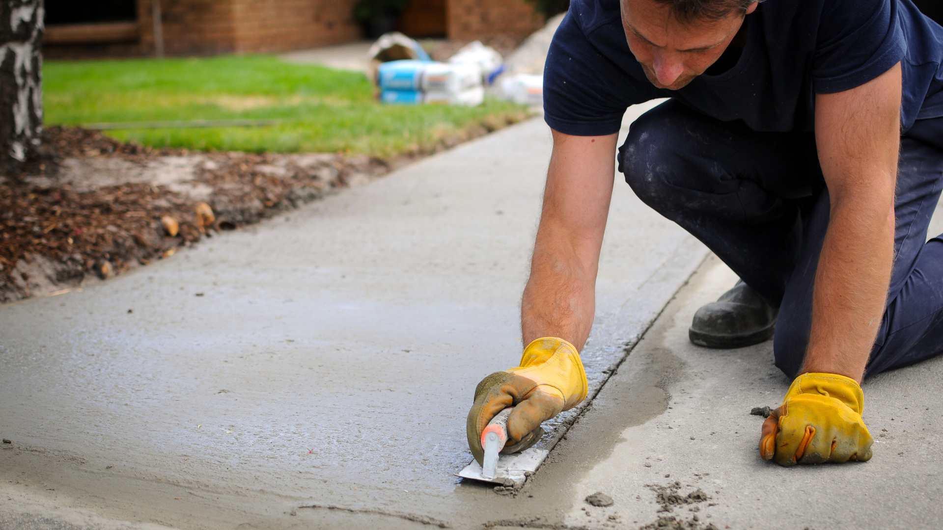 Stamped concrete driveway in Napa CA featuring a decorative stone pattern for a high-end residential home