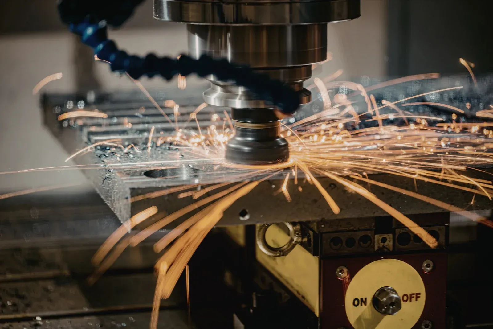 CNC machine cutting metal, sparks flying, industrial setting, 