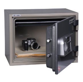 A safe with the door open and a camera in it