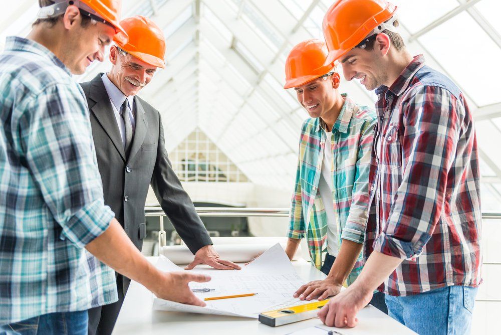 Portrait Of Male Professionals In The Office Center — Wendy's Safety Services In Moulden, NT