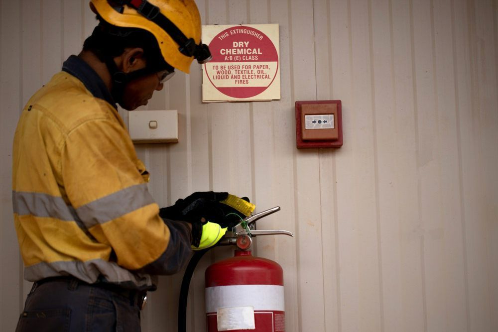 Safety Supervisor Wearing Safety Glove Yellow — Wendy's Safety Services In Moulden, NT