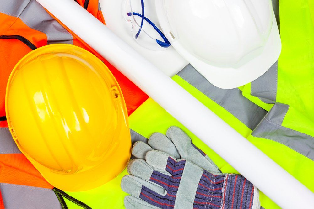 Yellow And White Hard Safety Hats With Protective Gloves — Wendy's Safety Services In Alice Springs, NT