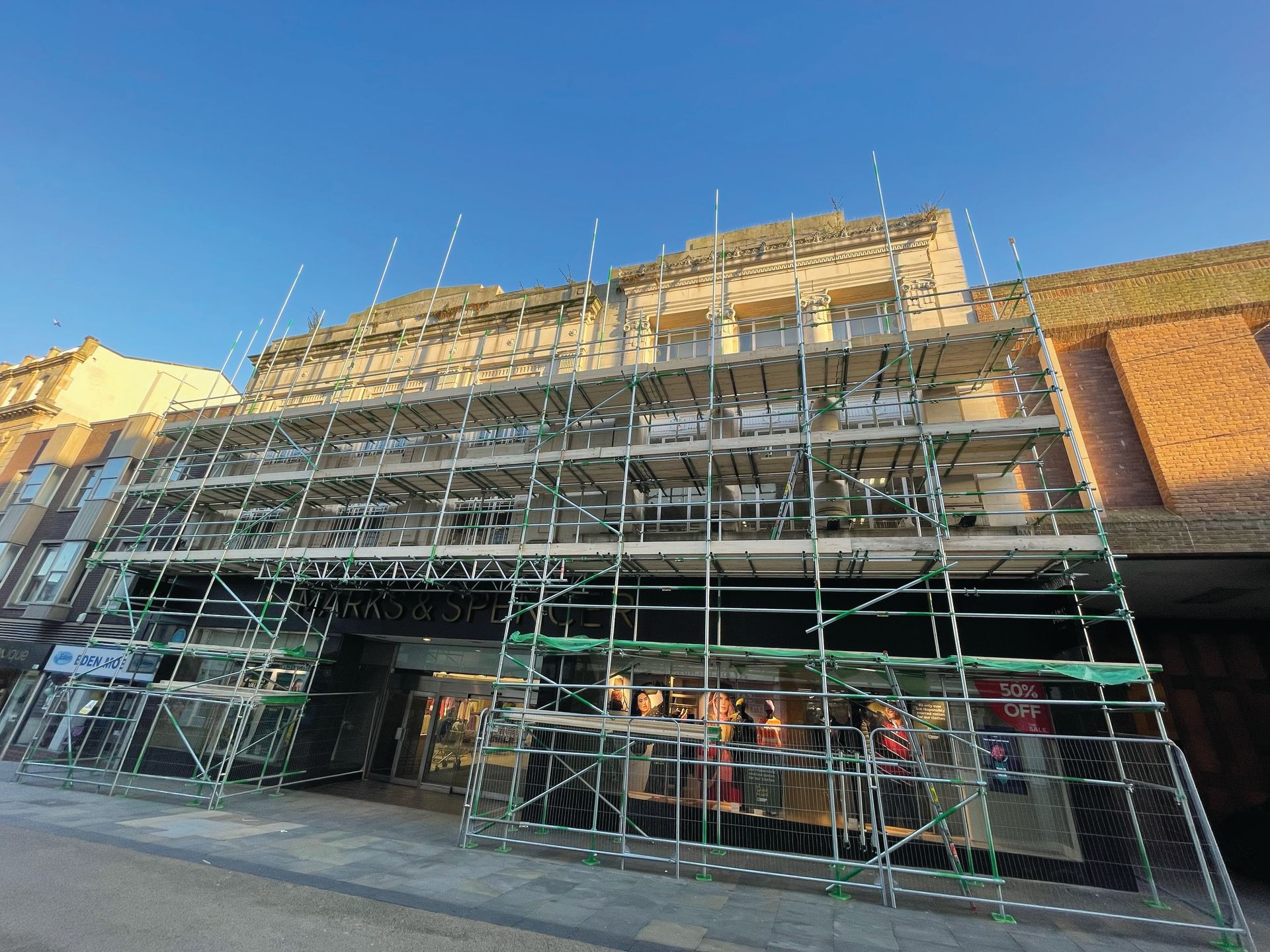 A large building with scaffolding on the side of it.