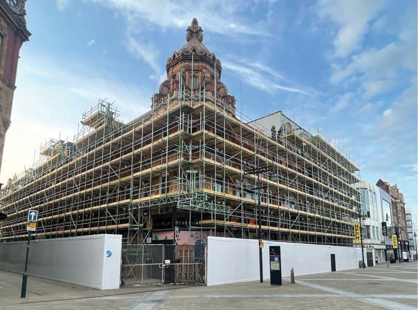 A large building is being built with scaffolding around it.