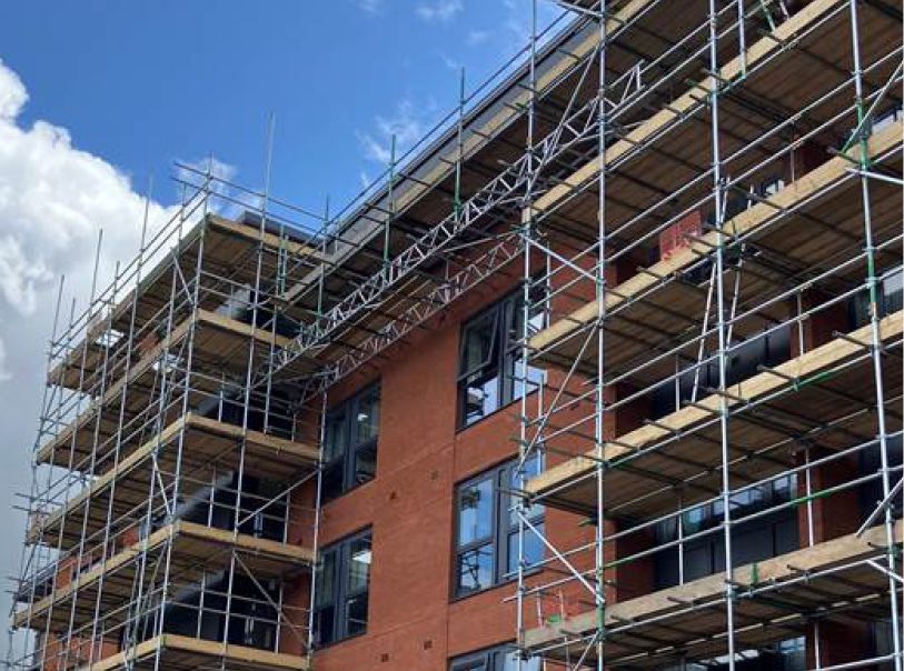 A large building under construction with scaffolding around it.