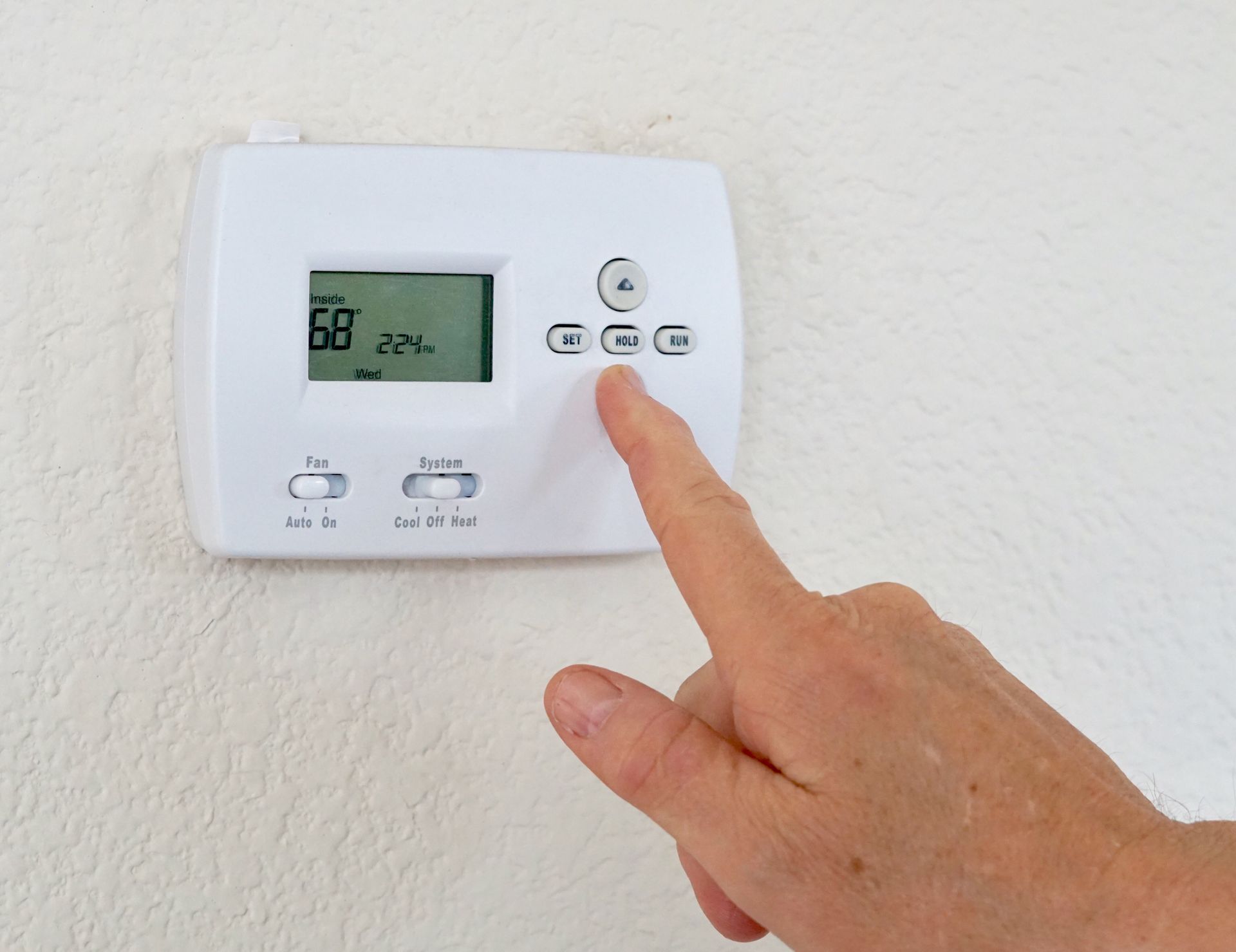A Remote Controlled Thermostat. Call Controlled Heating & Cooling for AC Repair in Mid-MO.