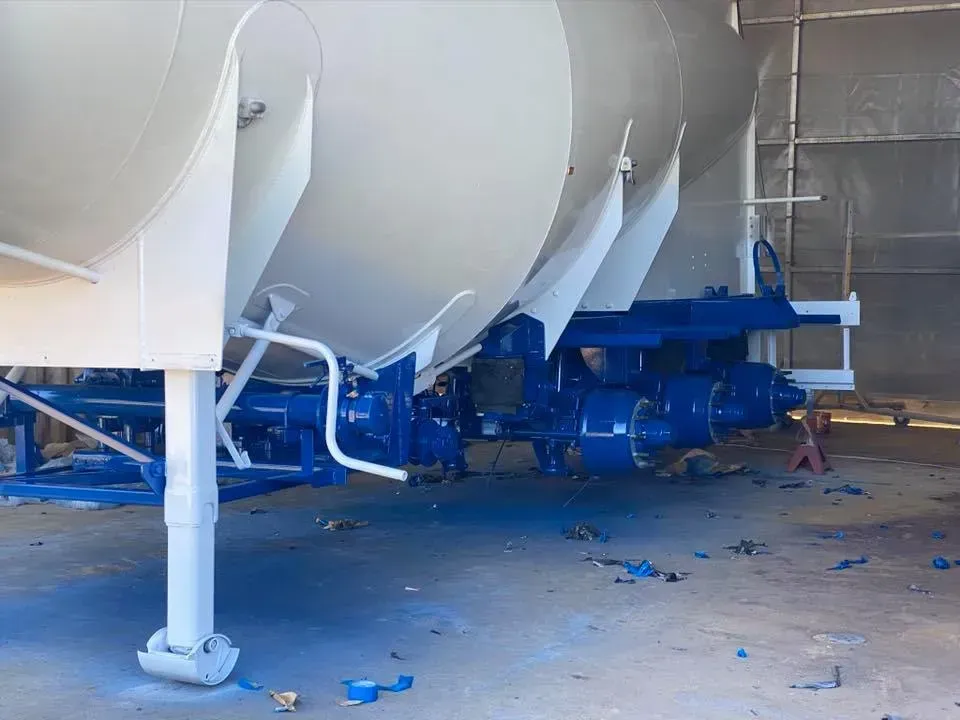 A Large White and Blue Industrial Tanker Being Painted Blue — All Blast and Paint in Bakers Creek, QLD