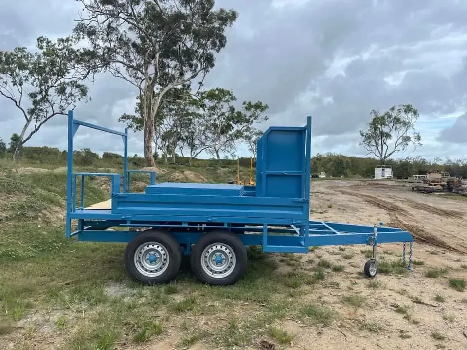 Blue Utility Trailer With Dual Wheels, Parked on Grass — All Blast and Paint in Marian, QLD