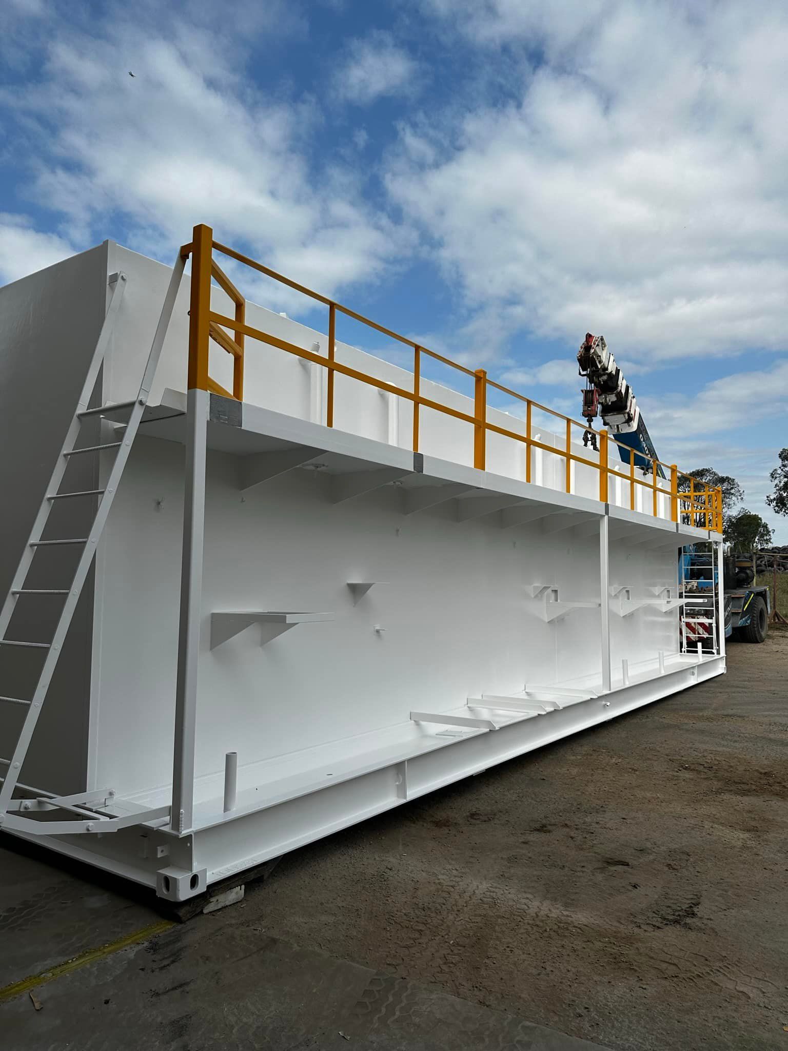 White Industrial Tank With Yellow Railing and Ladder — All Blast and Paint in Sarina, QLD