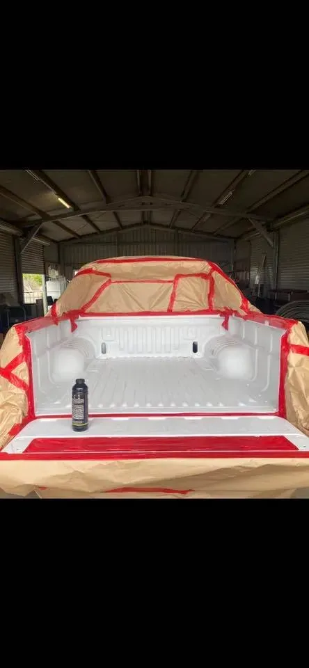 A Truck Bed Masked Off for Painting With White Primer — All Blast and Paint in Bakers Creek, QLD
