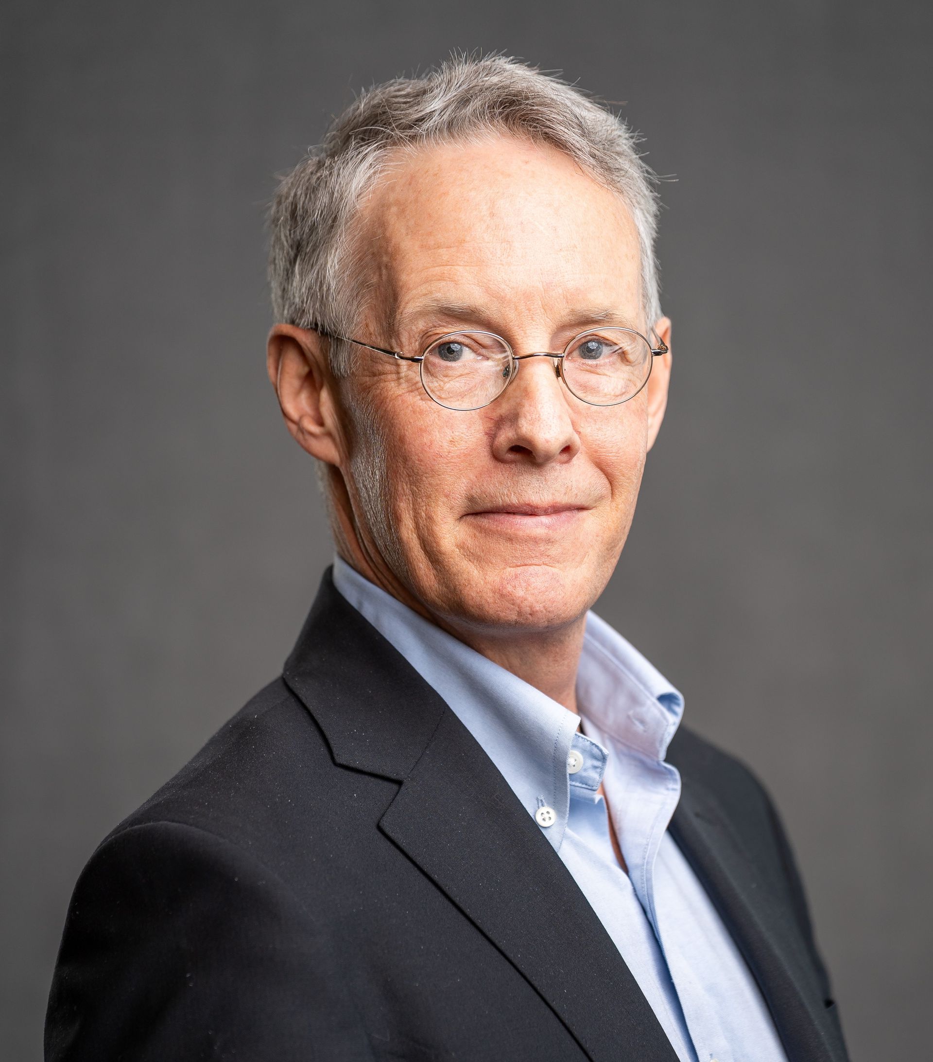 Professional portrait of Annie Morris, team member at 733Park, wearing a blue top and smiling against a light background.