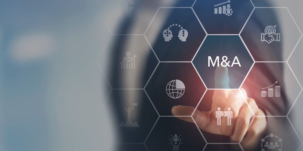 Hand touching a digital M&A interface with hexagon icons on a blue background