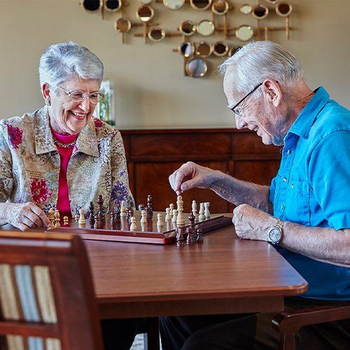 couple playing chess in independent living in Topeka KS at Aldersgate