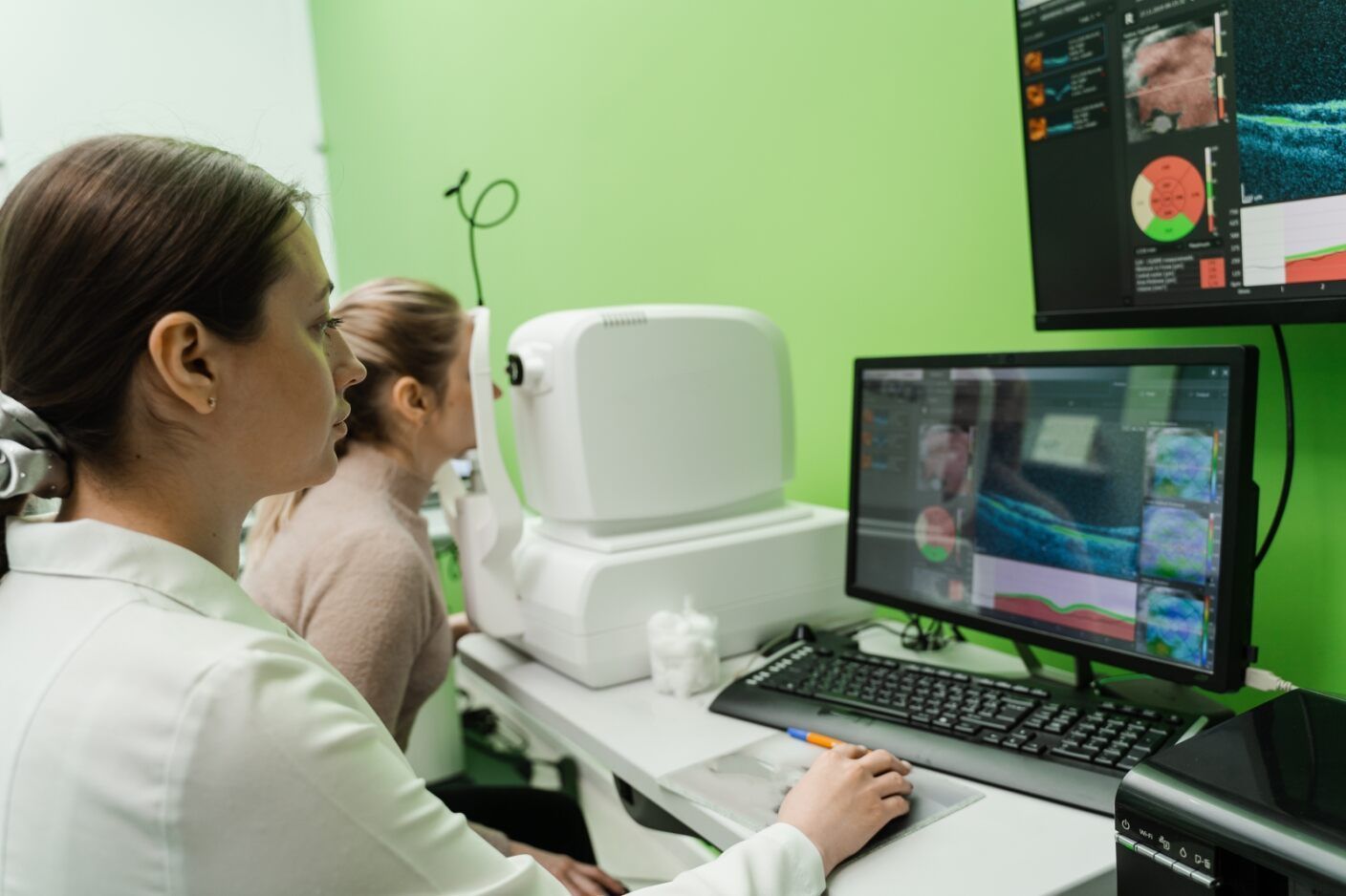 A Woman is Sitting at a Desk in Front of a Computer — Eyepower In Tahmoor, NSW