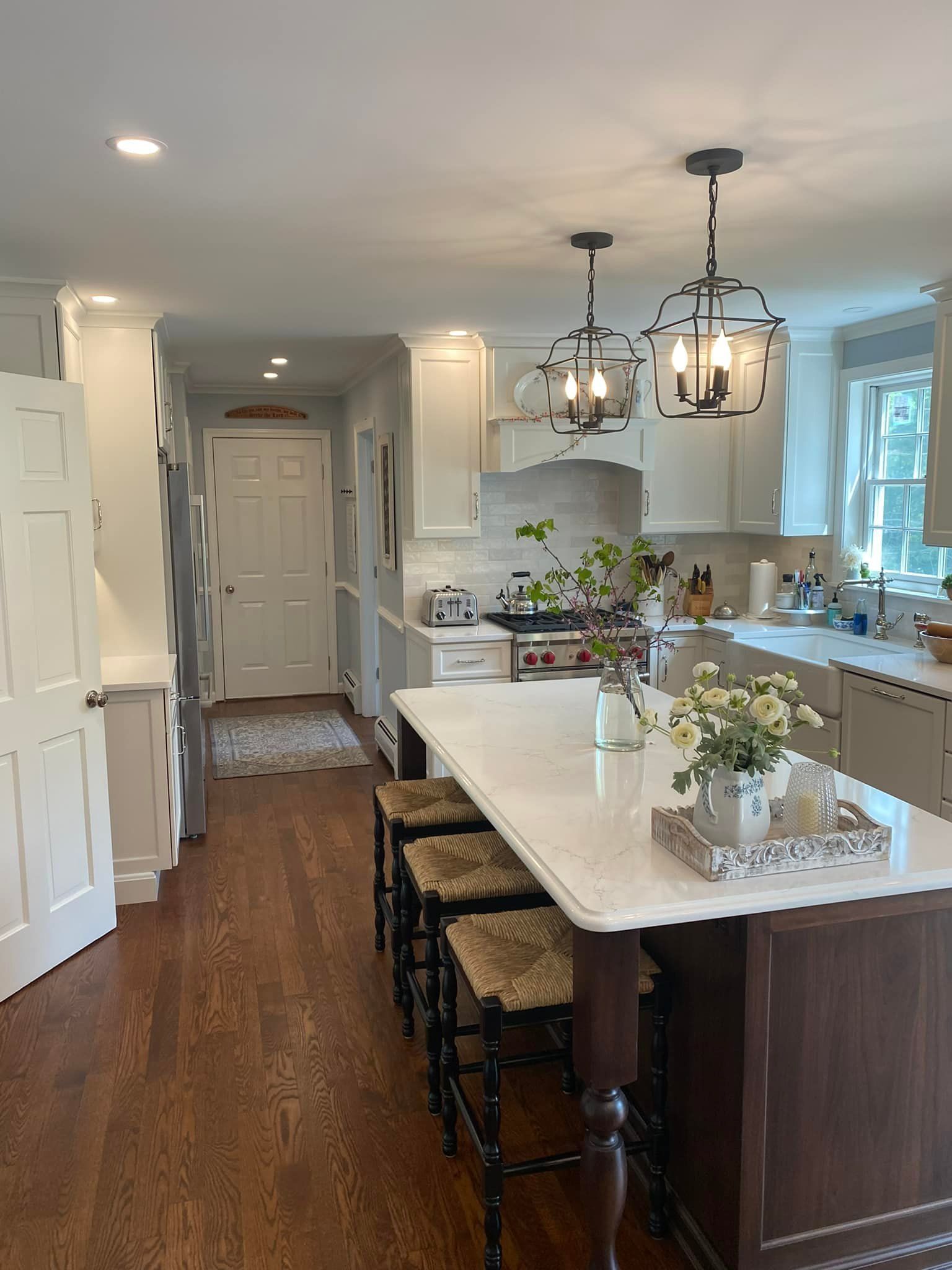 A kitchen with a large island in the middle of it.