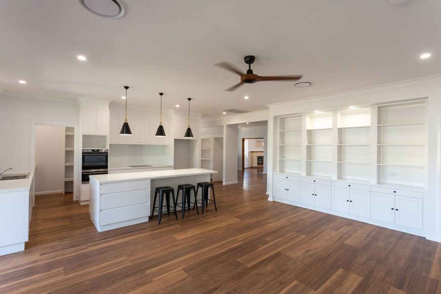 There is a ceiling fan in the middle of the room.