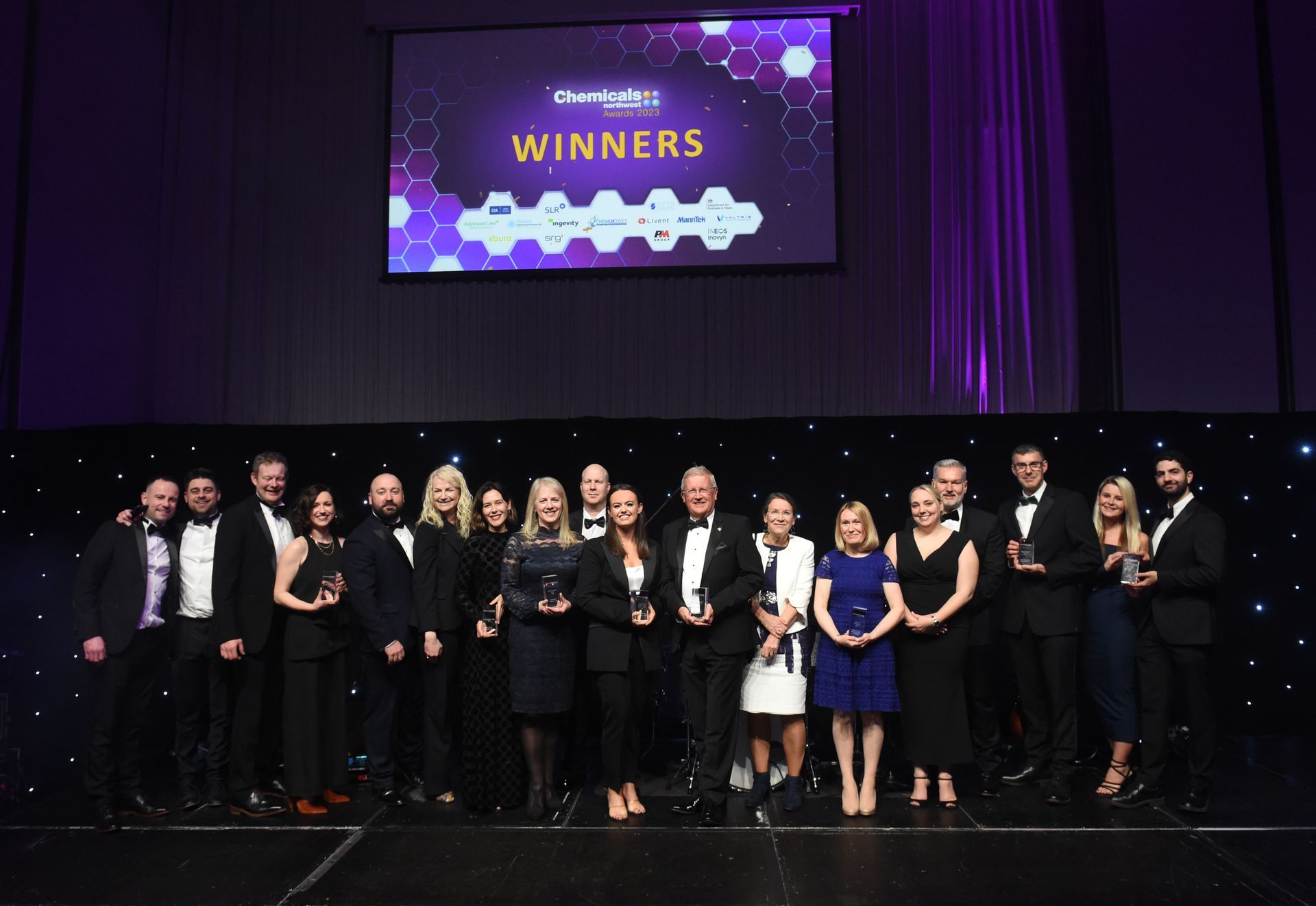 Winners stand on stage with their awards at the CNW awards 2023