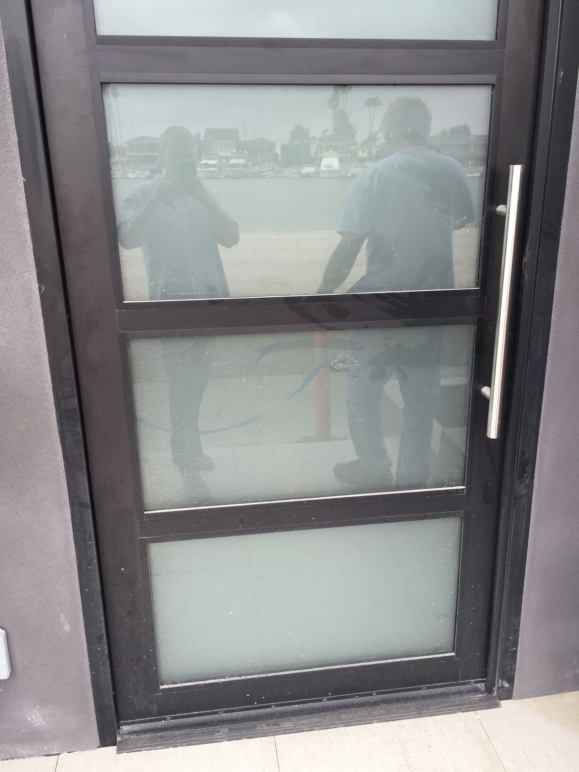 Four wooden Adirondack chairs around a fire pit in a gravel-covered outdoor space. Four wooden Adirondack chairs around a fire pit in a gravel-covered outdoor space.