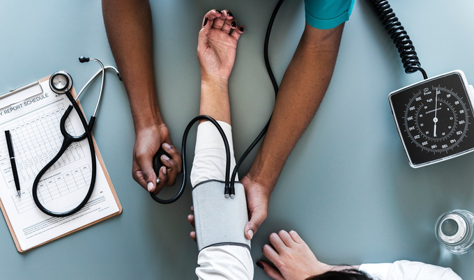 Woman getting blood pressure checked