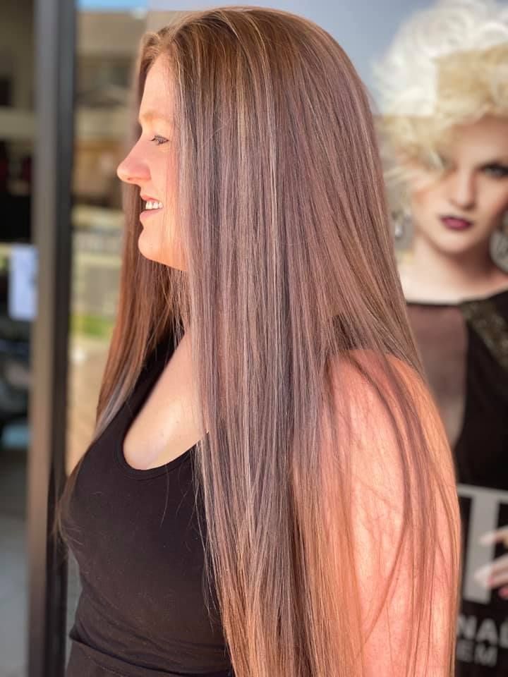 A Woman with Long Brown Hair Is Wearing a Black Tank Top — Hair It Is In Balgownie, NSW