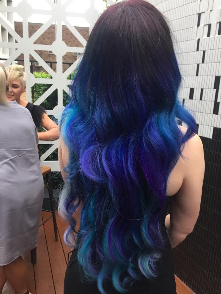A Woman with Long Blue and Purple Hair Is Standing on A Deck — Hair It Is In Balgownie, NSW