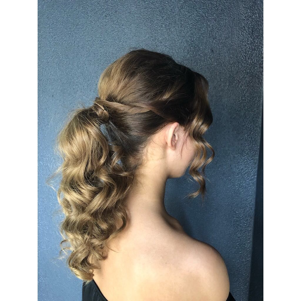 A Woman Is Wearing Her Hair in A Ponytail — Hair It Is In Balgownie, NSW