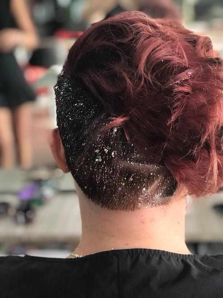 A Woman with Red Hair Has a Bun with Glitter on It — Hair It Is In Balgownie, NSW
