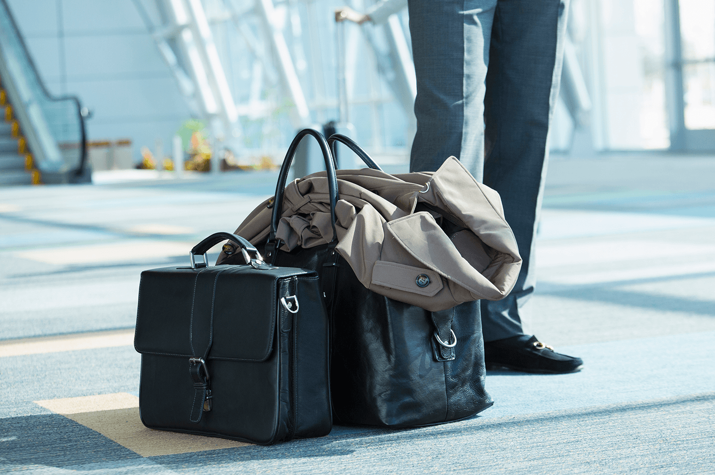 Coat and black hand luggage