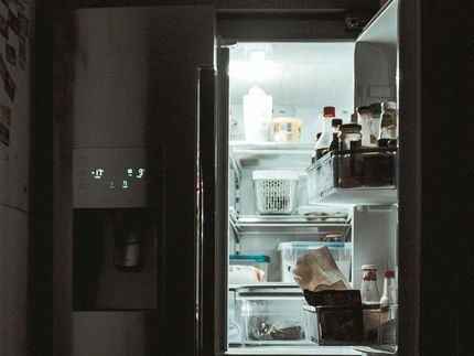 An open refrigerator with a lot of food in it.